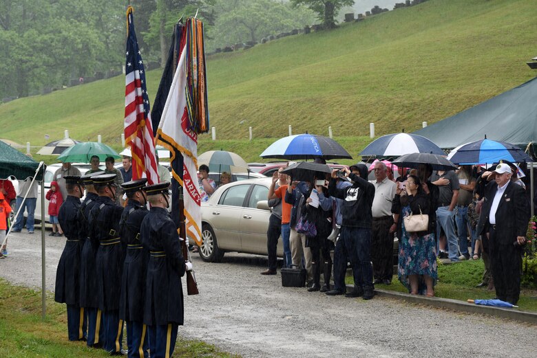 Soldiers from the 3rd United States Infantry Regiment, the Old Guard, present the colors during a reinterment May 12, 2017 for Private Samuel Howard, Revolutionary War soldier, at Resthaven Cemetery in Baxter, Ky.