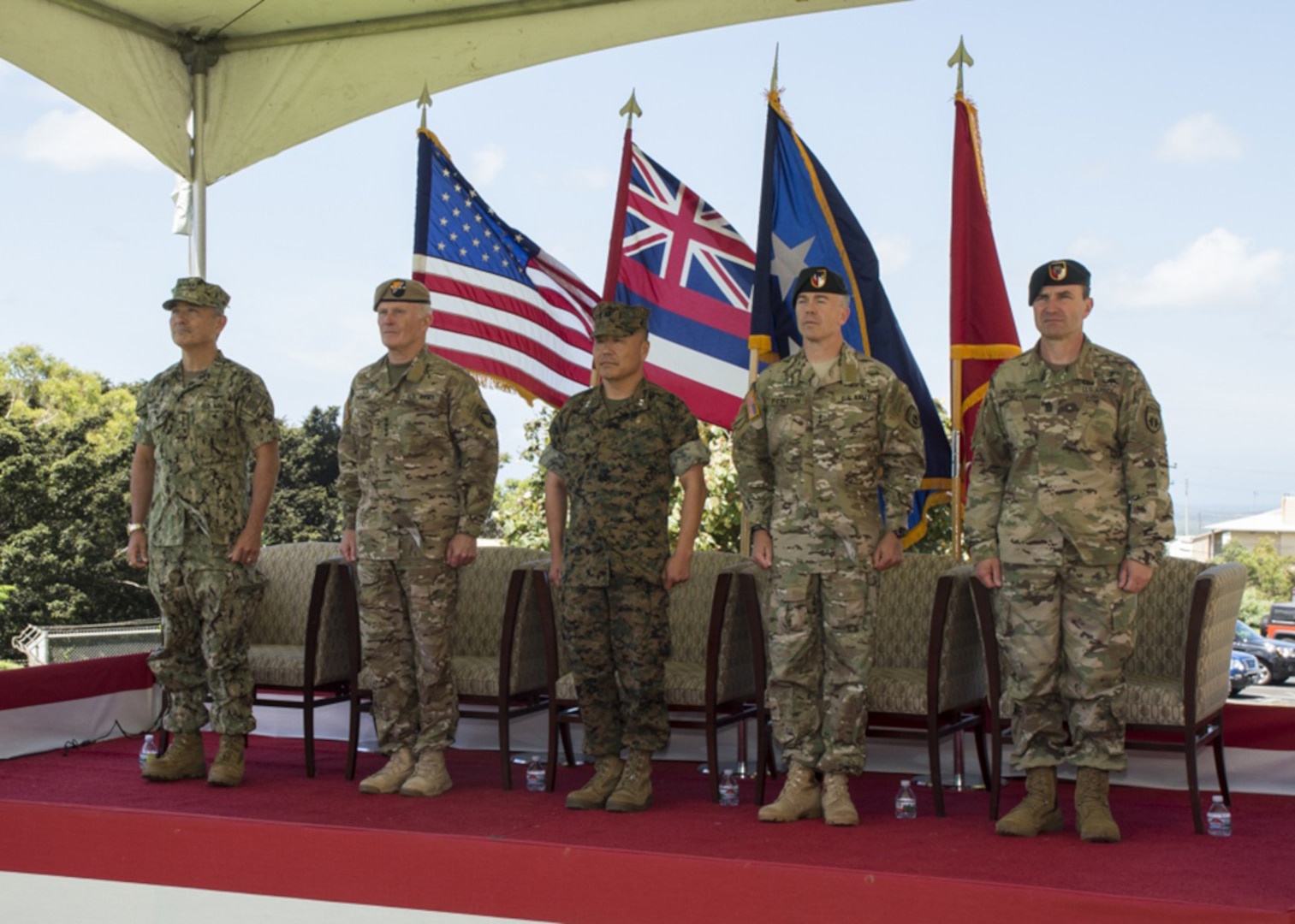 Navy Adm. Harry B. Harris, commander of U.S. Pacific Command, left, Army Gen. Raymond A. Thomas, commander, U.S. Special Operations Command, Marine Corps Maj. Gen. Daniel D. Yoo, commander, U.S. Special Operations Command, Pacific (SOCPAC), Army Maj. Gen. Bryan P. Fenton, and Command Sgt. Maj. Shane Shorter stand during the playing of the Armed Services Medley at the conclusion of SOCPAC's Change of Command ceremony, May 12, 2017