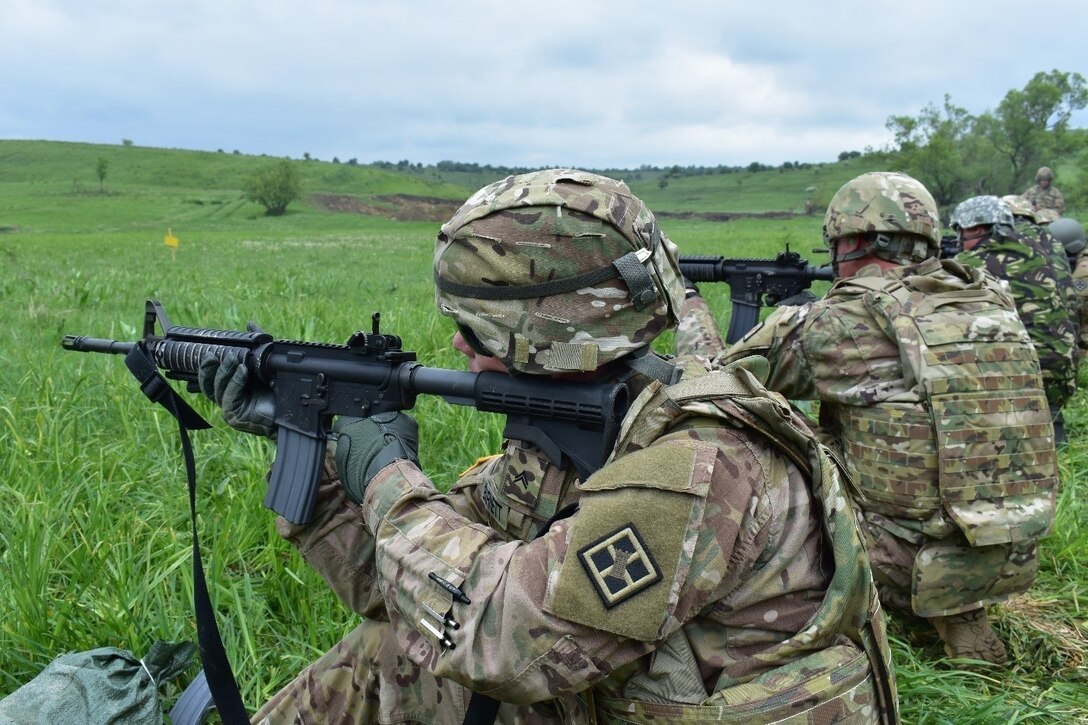 Cpl. Christopher Barnett from the 926th Engineer Battalion, 926th Engineer Brigade, United States Army Reserves, qualifies in the kneeling position at a M4 qualification range at Joint National Training Center, Cincu, Romania, as part of Resolute Castle 17, May 10, 2017. Resolute Castle 17 is an exercise strengthening the NATO alliance and enhancing its capacity for joint training and response to threats within the region.