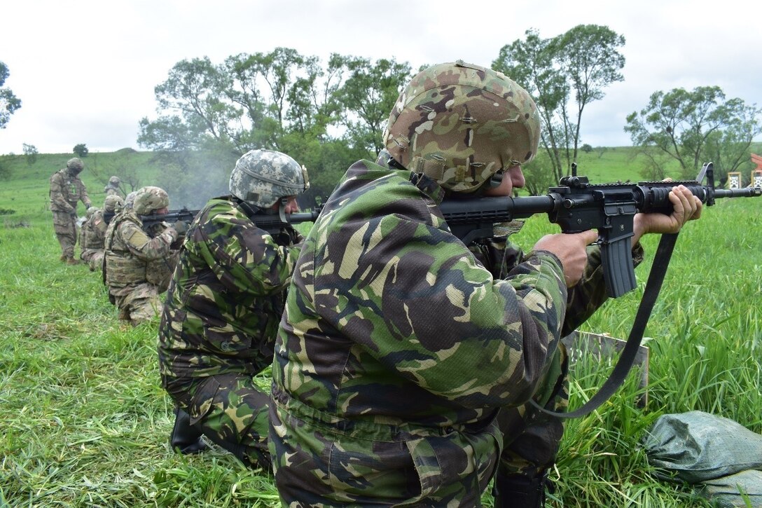 Soldiers from the Romanian 136th Engineer Battalion, 10th Engineer Brigade and the 926th Engineer Battalion, 926th Engineer Brigade, United States Army Reserves, qualify in the kneeling position at an M4 qualification range at Joint National Training Center, Cincu, Romania, as part of Resolute Castle 17, May 10, 2017. Resolute Castle 17 is an exercise strengthening the NATO alliance and enhancing its capacity for joint training and response to threats within the region.