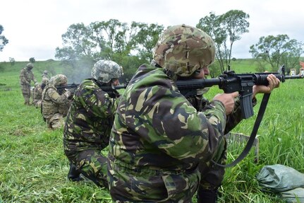 Soldiers from the Romanian 136th Engineer Battalion, 10th Engineer Brigade and the 926th Engineer Battalion, 926th Engineer Brigade, United States Army Reserves, qualify in the kneeling position at an M4 qualification range at Joint National Training Center, Cincu, Romania, as part of Resolute Castle 17, May 10, 2017. Resolute Castle 17 is an exercise strengthening the NATO alliance and enhancing its capacity for joint training and response to threats within the region.