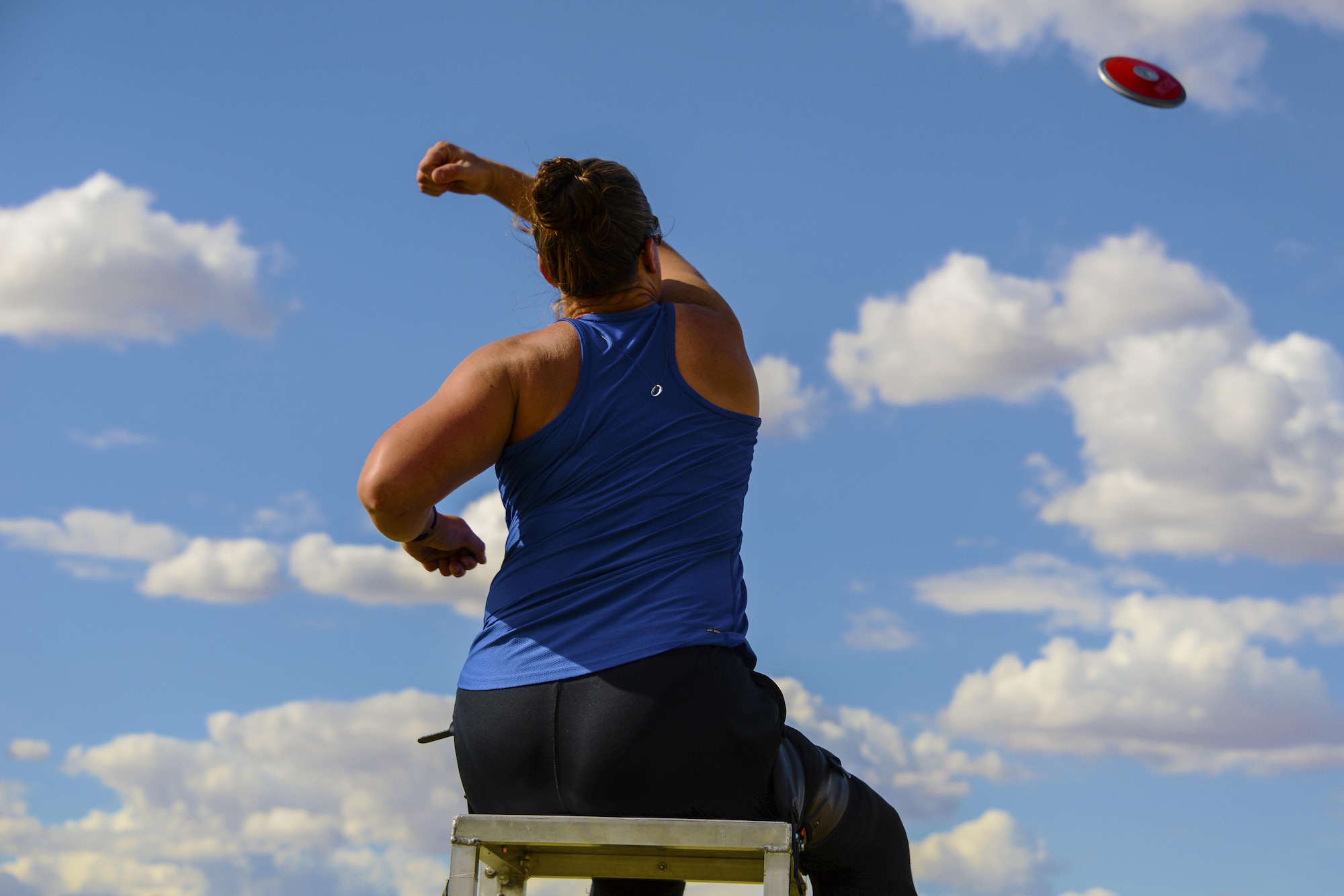 Christy Gardner, 2017 Paralympics competitor, practices throwing a discus May 10, 2017, at Luke Air Force Base, Ariz. Luke had the opportunity to help U.S. and international male and female athletes with permanent physical disabilities that are interested in competitive athletics. (U.S. Air Force photo by Airman 1st Class Caleb Worpel)