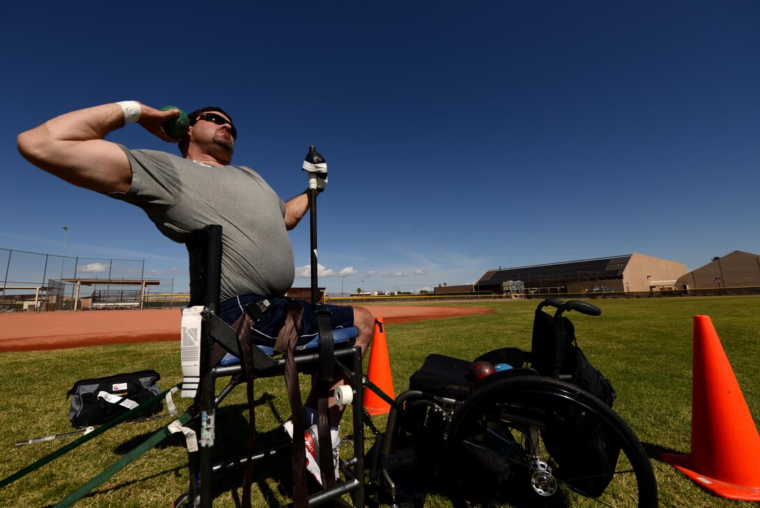 Scott Severn, 2017 Paralympian competitor, prepares to throw the shotput into the air May 10, 2017, at Luke Air Force Base, Ariz. Severn is a three-time Paralympic competitor and a two-time Paralympic medalist in the shotput. (U.S. Air Force photo by Airman 1st Class Alexander Cook) 