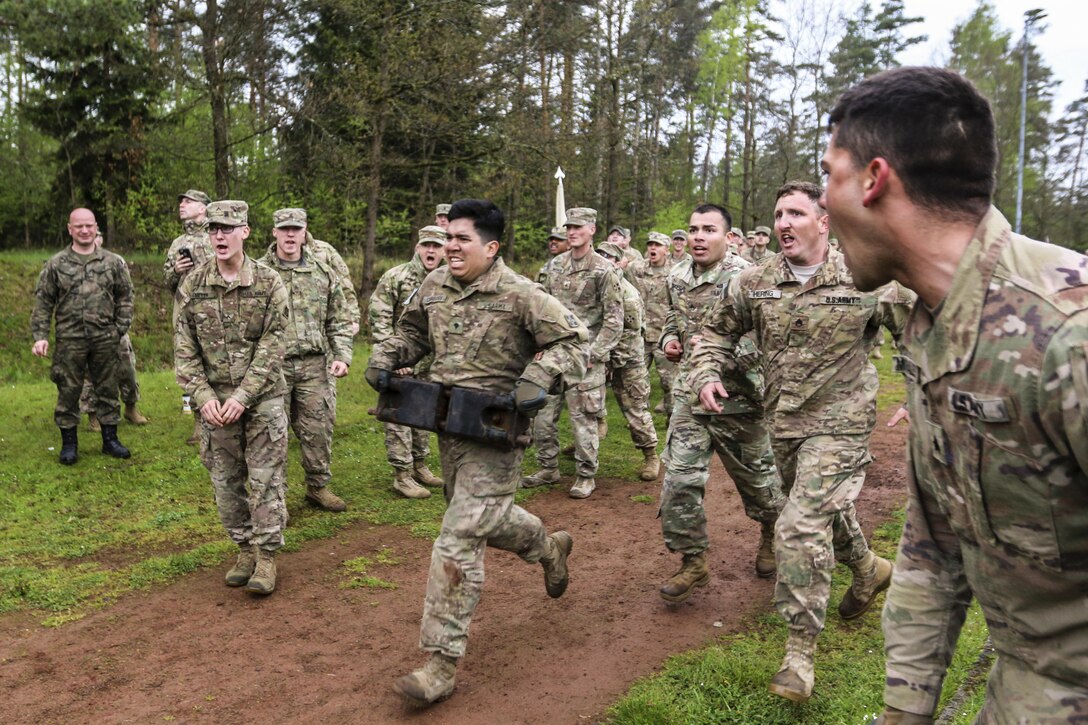 U.S. soldiers compete against soldiers from other nations in a relay race with tank-related objects during the Strong Europe Tank challenge in Grafenwoehr, Germany, May 12, 2017. The event provides an environment for sharing tactics, techniques and procedures. Army photo by Staff Sgt. Kathleen V. Polanco
