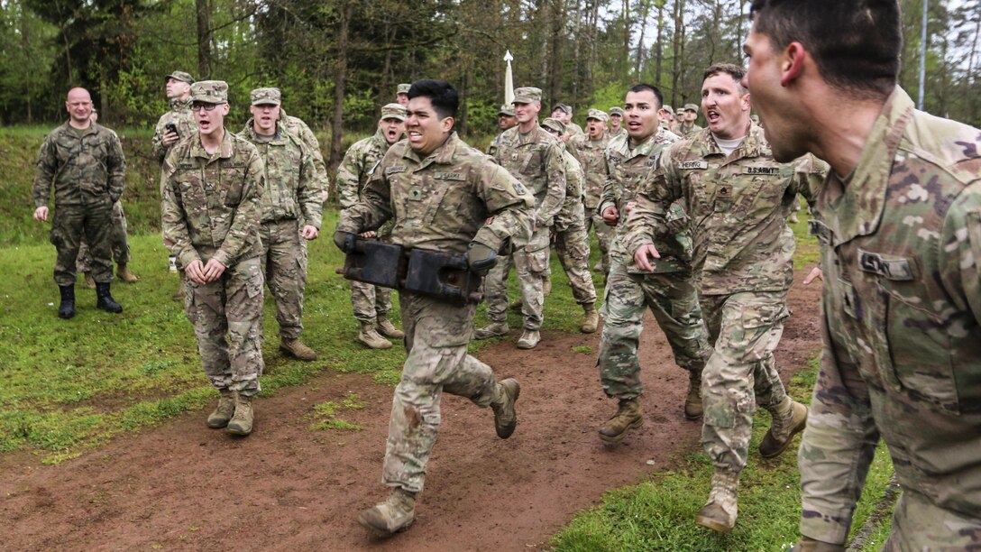 U.S. soldiers compete against soldiers from other nations in a relay race with tank-related objects during the Strong Europe Tank Challenge in Grafenwoehr, Germany,
 May 12, 2017. The event provides an environment for sharing tactics, techniques and procedures. Army photo by Staff Sgt. Kathleen V. Polanco
