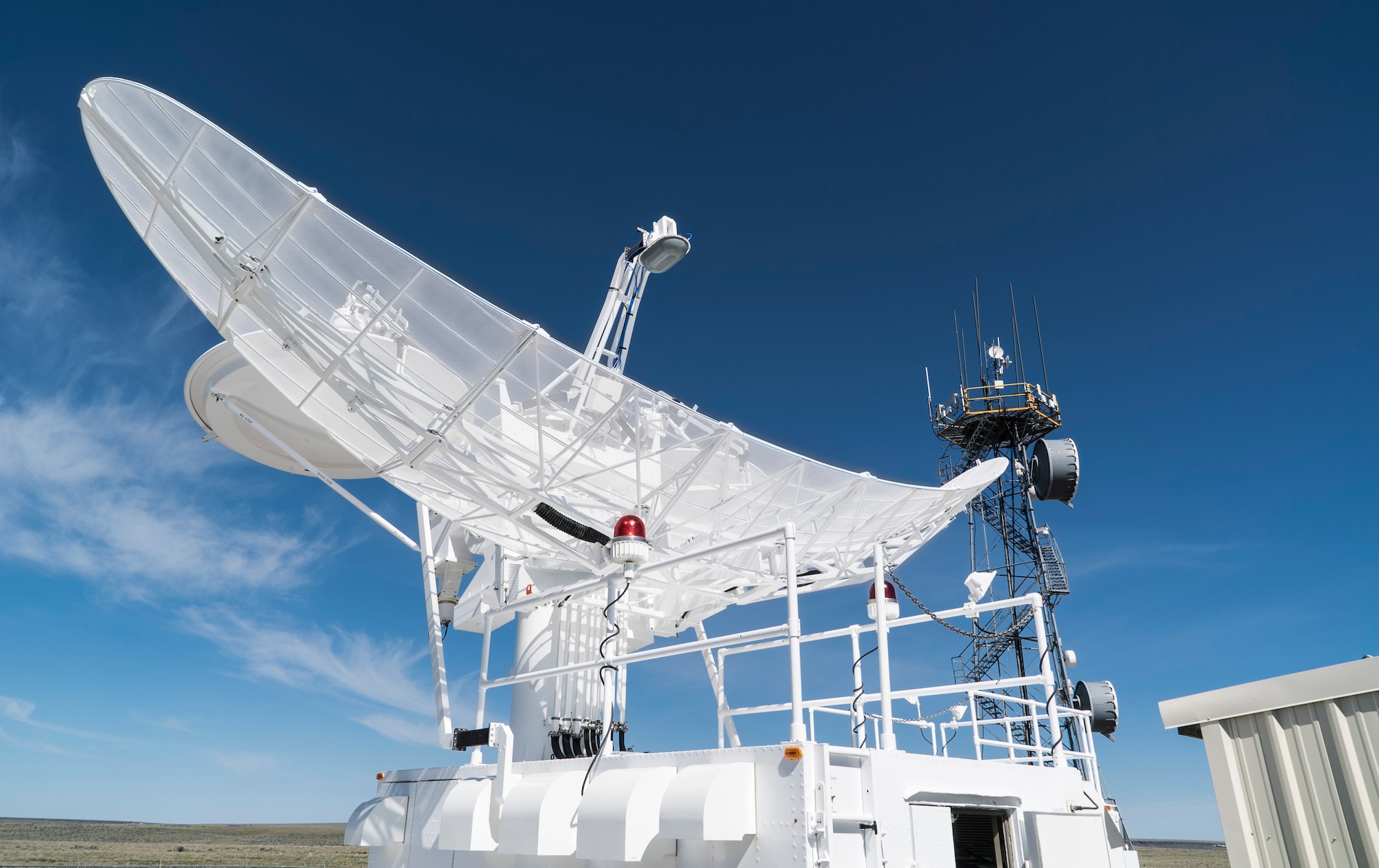 The dish for the 266th Range Squadron's Multiple Threat Emitter System shines in the morning sun at the Mountain Home Air Force Base Range Complex in Idaho May 9, 2017. The system can simulate 65 different types of ground threats to help train air crews through scenarios that mimic real enemy threats the crews might face. (U.S. Air Force photo/Staff Sgt. Samuel Morse)