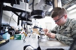 Staff Sgt. Zachary Dowd, Air Force Repair Enhancement Program circuit card technician, replaces a resistor on a power supply at Mountain Home Air Force Base, Idaho, May 8, 2017. The four-person AFREP team saved the Air Force a combined $1.3 million in 2016, and is on-track to save $2.5 million in 2017, between cost savings and cost avoidance. (U.S. Air Force photo/Staff Sgt. Samuel Morse)