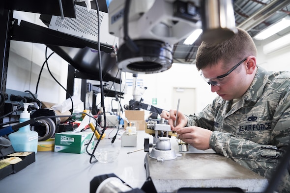 Staff Sgt. Zachary Dowd, Air Force Repair Enhancement Program circuit card technician, replaces a resistor on a power supply at Mountain Home Air Force Base, Idaho, May 8, 2017. The four-person AFREP team saved the Air Force a combined $1.3 million in 2016, and is on-track to save $2.5 million in 2017, between cost savings and cost avoidance. (U.S. Air Force photo/Staff Sgt. Samuel Morse)