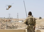 AMMAN, Jordan (May 11, 2017)  An Air Force Combat Controller, part of the 23rd Special Tactics Squadron, watches as a Jordanian UH-60 helicopter makes an approach during Eager Lion 2017. Eager Lion is an annual U.S. Central Command exercise in Jordan designed to strengthen military-to-military relationships between the U.S., Jordan and other international partners. This year's iteration is comprised of about 7,200 military personnel from more than 20 nations that will respond to scenarios involving border security, command and control, cyber defense and battlespace management. (U.S. Navy photo by Mass Communication Specialist 2nd Class Christopher Lange/Released)