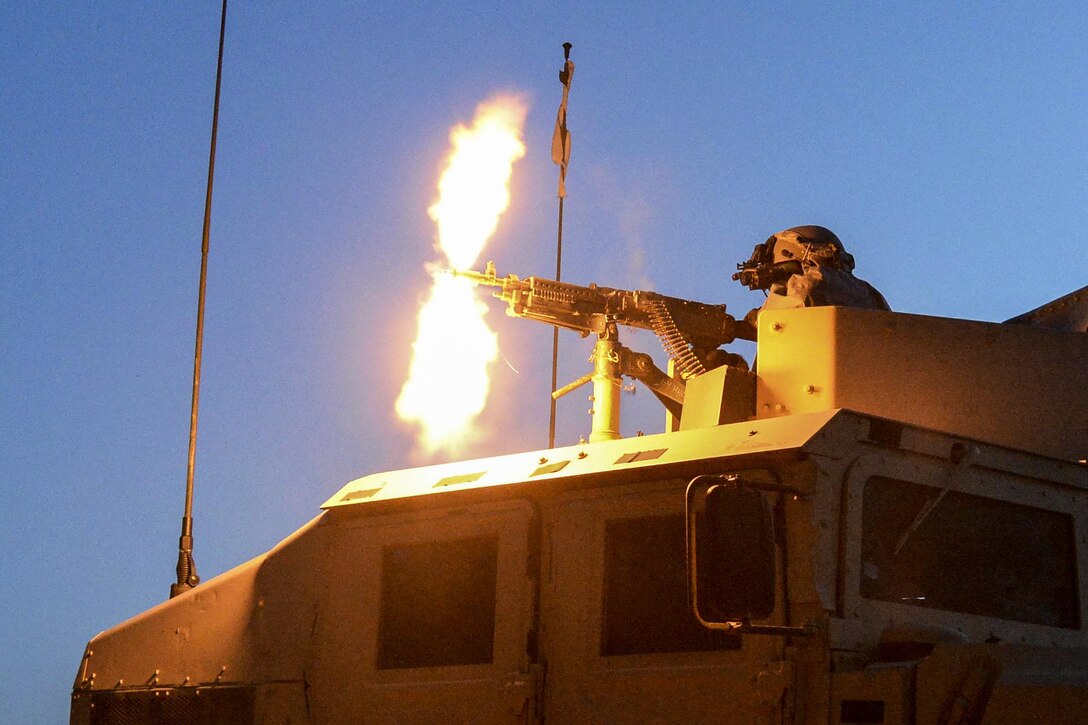 A soldier fires a machine gun from the turret of a tactical vehicle during Saber Junction 17, an exercise with about 4,500 participants from 13 NATO and partner nations at the Joint Multinational Readiness Center, Hohenfels, Germany, May 15, 2017. The soldier is assigned to 1st Battalion, 4th Infantry Regiment. Army photo by Staff Sgt. Richard Frost

