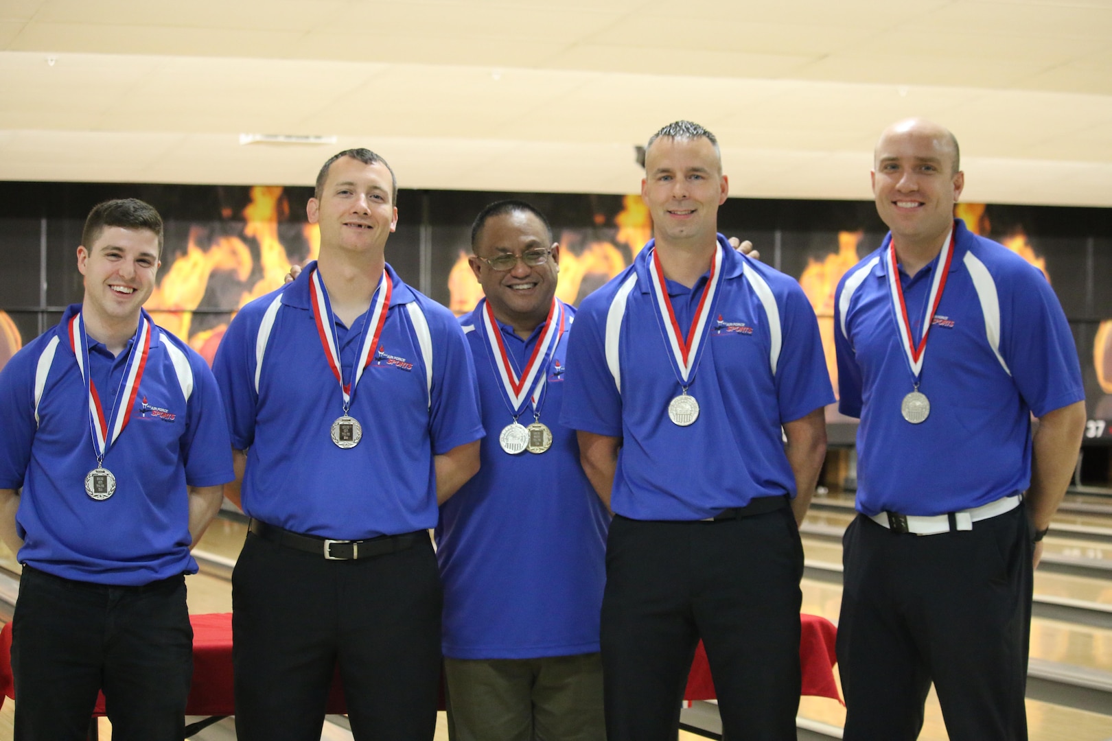 Air Force Men take Team Silver at the 2017 Armed Forces Bowling Championship hosted at Marine Corps Base Camp Pendleton, California from 5-8 May at the Leatherneck Lanes. Picture here is: Tech. Sgt. Chuck Kropog, Yokota AB, Japan; Tech. Sgt. Hans Schnell, Peterson AFB, Colo.; Staff Sgt. James McTaggart, Nellis AFB, Neveda; Staff Sgt. Marshal Crider, Ramstein AB, Germany