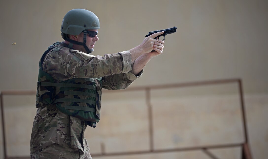 Master Sgt. Sean Elliot, 36th Operations Support Squadron airfield flight equipment superintendent, shoots an M9 pistol during the Defender Challenge May 15, 2017, at Andersen Air Force Base, Guam. The 36th Security Forces Squadron hosted the Defender Challenge, pitting Airmen against a variety of obstacles and navigational tasks. The event was part of National Police week, which honors the service and sacrifice of law enforcement officers. (U.S. Air Force photo by Senior Airman Joshua Smoot)