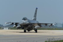 A U.S. Air Force F-16 Fighting Falcon taxis down a runway at Kunsan Air Base, Republic of Korea, May 15, 2017. Six aircraft from the 35th Fighter Squadron departed Kunsan to take part in Buddy Wing 17-4 from May 15-19. (U.S. Air Force photo by Senior Airman Michael Hunsaker/Released)