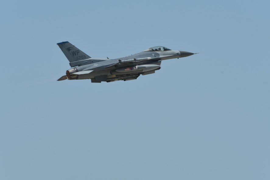 A U.S. Air Force F-16 Fighting Falcon flies above Kunsan Air Base, Republic of Korea, May 15, 2017. Six aircraft from the 35th Fighter Squadron departed Kunsan to participate in Buddy Wing 17-4. The exercise enhances interoperability between U.S. and ROK forces for combined operations. (U.S. Air Force photo by Senior Airman Michael Hunsaker/Released)