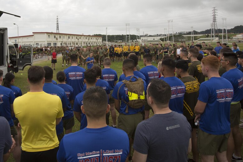 Col. William L. Depue Jr. gives his opening remarks during the Cpl. Medina and Lance Cpl. Hug 2nd Annual Memorial Run May 12 aboard Camp Foster, Okinawa, Japan. On May 12, 2015, Cpl. Sara A. Medina, 23, a combat photographer and Lance Cpl. Jacob A. Hug, 22, a combat videographer assigned to Headquarters and Support Battalion, Marine Corps Installations Pacific-Marine Corps Base Camp Butler, Japan, died while providing humanitarian assistance and disaster relief to remote villages in Nepal during operation Sahayogi Haat. Marines, sailors and members of the military community came from all over Okinawa to honor Medina and Hug. Depue is the Headquarters and Support Battalion commanding officer, and Camp Foster camp commander.