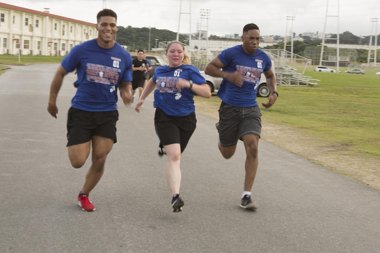 Marines finish strong during the Cpl. Medina and Lance Cpl. Hug 2nd Annual Memorial Run May 12 aboard Camp Foster, Okinawa, Japan. On May 12, 2015, Cpl. Sara A. Medina, 23, a combat photographer and Lance Cpl. Jacob A. Hug, 22, a combat videographer assigned to Headquarters and Support Battalion, Marine Corps Installations Pacific-Marine Corps Base Camp Butler, Japan, died while providing humanitarian assistance and disaster relief to remote villages in Nepal during operation Sahayogi Haat. Marines, sailors and members of the military community came from all over Okinawa to honor Medina and Hug.