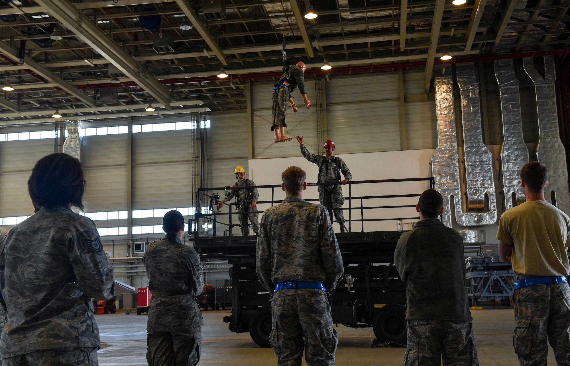 Airmen assigned to the 721st Aircraft Maintenance Squadron participate in fall protection training on Ramstein Air Base, Germany, May 10, 2017. The training was conducted as part of the Occupational Safety and Health Administration's National Fall Prevention Stand-Down, which encourages employers to train their employees on fall hazards and the importance of fall protection. (U.S. Air Force photo by Senior Airman Tryphena Mayhugh)