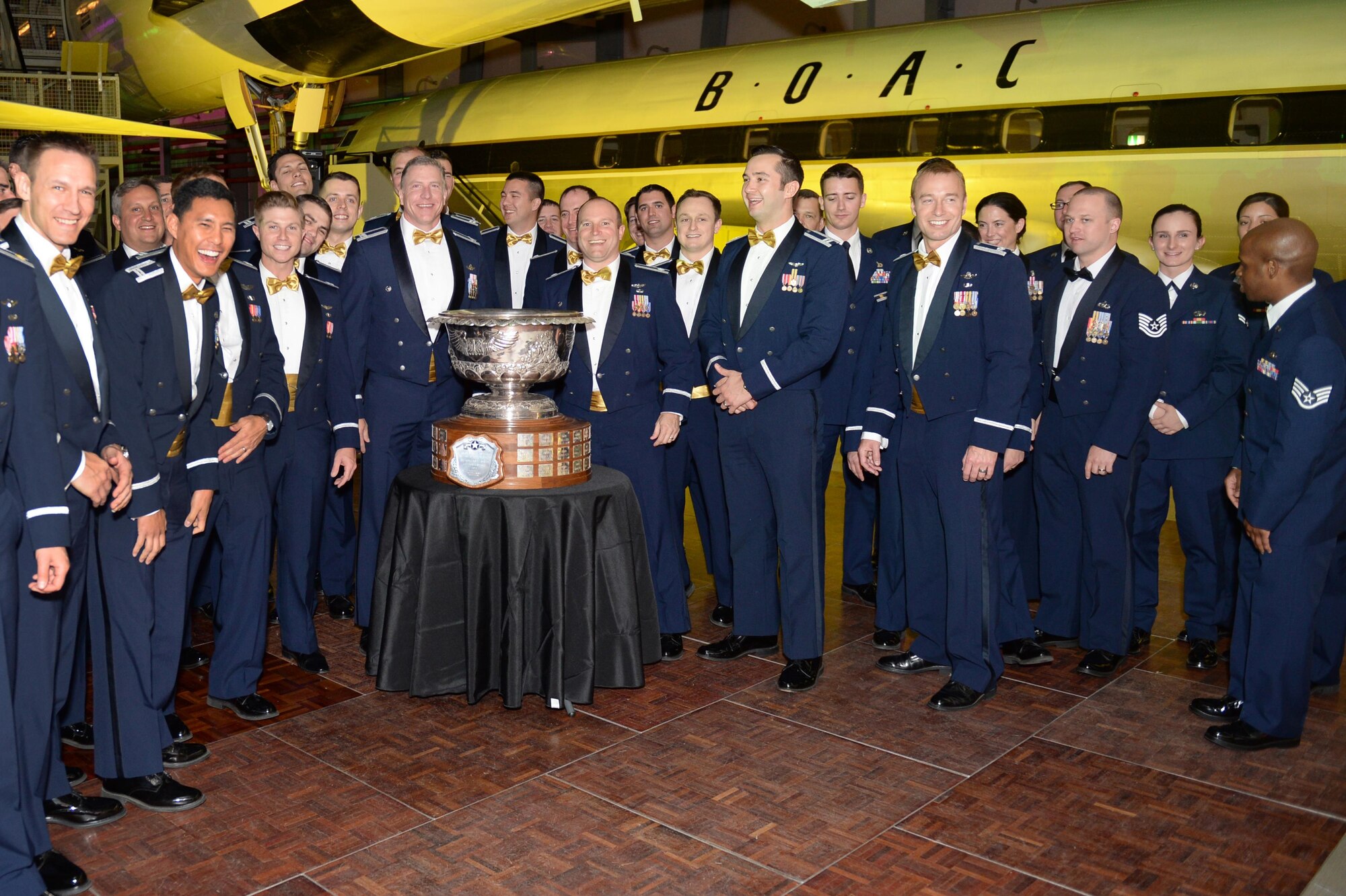 48th Fighter Wing Airmen celebrate during the 2016 Raytheon Trophy presentation at the Duxford Imperial War Museum, England, May 13.  The trophy dates to 1953 and is awarded annually to the top air superiority or air defense squadron in the U.S. Air Force. (U.S. Air Force photo by Staff Sgt. Emerson Nuñez)