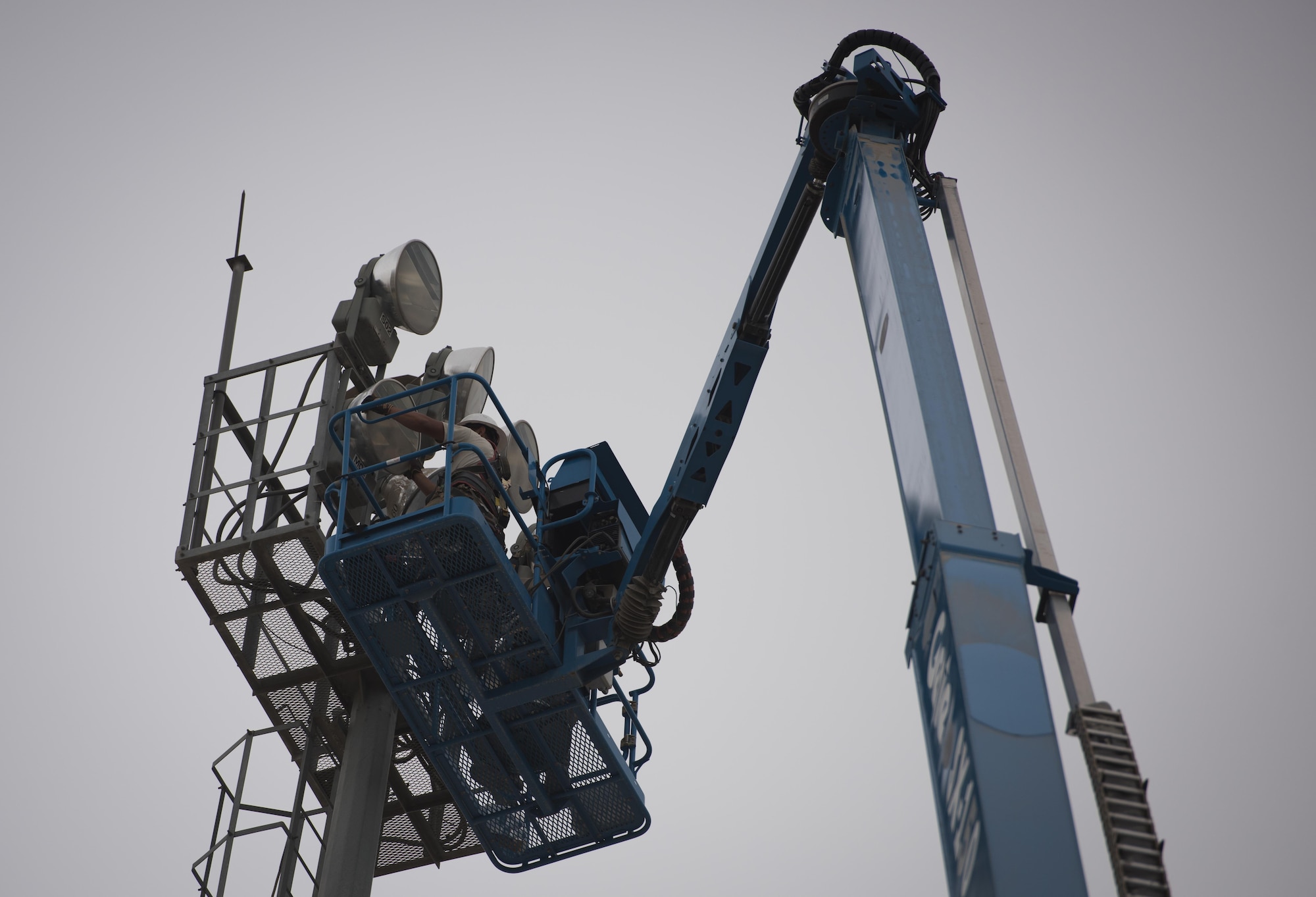 Airmen from the 455th Expeditionary Civil Engineer Squadron replace an airfield light at Bagram Airfield, Afghanistan, May 12, 2017. Engineers perform an inherently dangerous job, on top of the risks of being military members in a combat zone, some jobs also require them to go to great heights or work with malfunctioning equipment. In order to prevent injuries, engineers and all Airmen receive education and training on proper safety measures. (U.S. Air Force photo by Airman 1st Class BrieAnna Stillman)