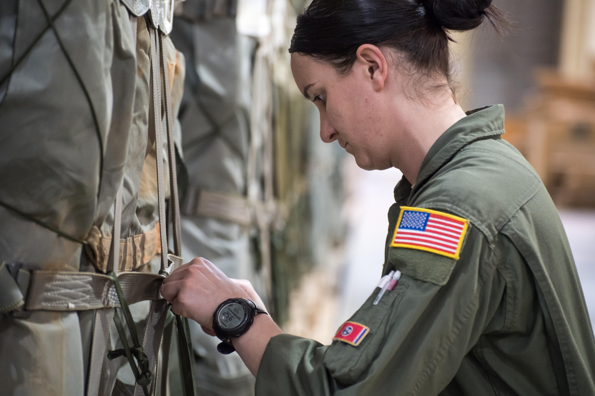 Staff Sgt. Casey Jackson, a 43d Operations Support Squadron joint airdrop inspector, inspects straps on a Container Delivery System -- or CDS -- while conducting an inspection of cargo at the Army’s Heavy Drop Rigging Facility here April 26. Jackson worked with fellow 43d OSS inspectors to ensure more than 200 tons of cargo were ready for airdrop from Air Force C-17s and C-130s flying out of Pope Field during a large package joint training exercise April 26-30. The 43d OSS is part of the Air Force’s 43d Air Mobility Operations Group, which provides 24/7 operational and training mission support for visiting Air Mobility Command aircraft and crews, for the 82nd Airborne Division and other Army units here, and for joint special forces units at Fort Bragg. (U.S. Air Force photo/Marc Barnes)