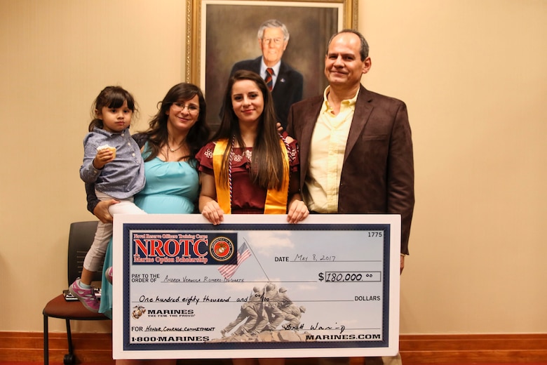 Veronica Andrea Romero-Dugarte, a senior at the Early College of North Forsyth, poses for a photo with her family after being presented with a Naval Reserve Officers Training Corps scholarship check at the Dewitt E. Rhoades Conference Center at Forsyth Tech Community College at Winston-Salem, North Carolina, May 8, 2017.  The NROTC scholarship, valued at up to $180,000, will pay for the cost of full tuition, books and other educational fees at many of the country’s leading colleges and universities. (U.S. Marine Corps photo by Sgt. Antonio J. Rubio/Released)