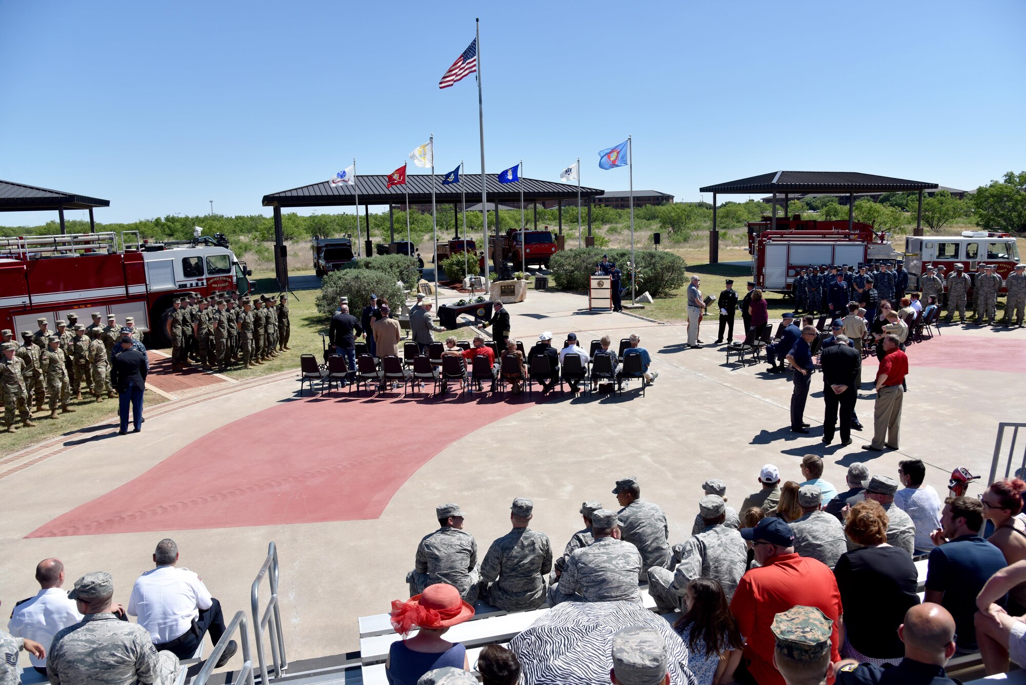 The 312th Training Squadron finalizes preparations for the memorial service at the Department of Defense Fallen Firefighter Memorial on Goodfellow Air Force Base, Texas, May 12, 2017. Each of the military services had a formation there to represent the joint training at the Louis F. Garland Department of Defense Fire Academy and to pay respect to the five fallen firefighters. (U.S. Air Force photo by Staff Sgt. Joshua Edwards/Released)