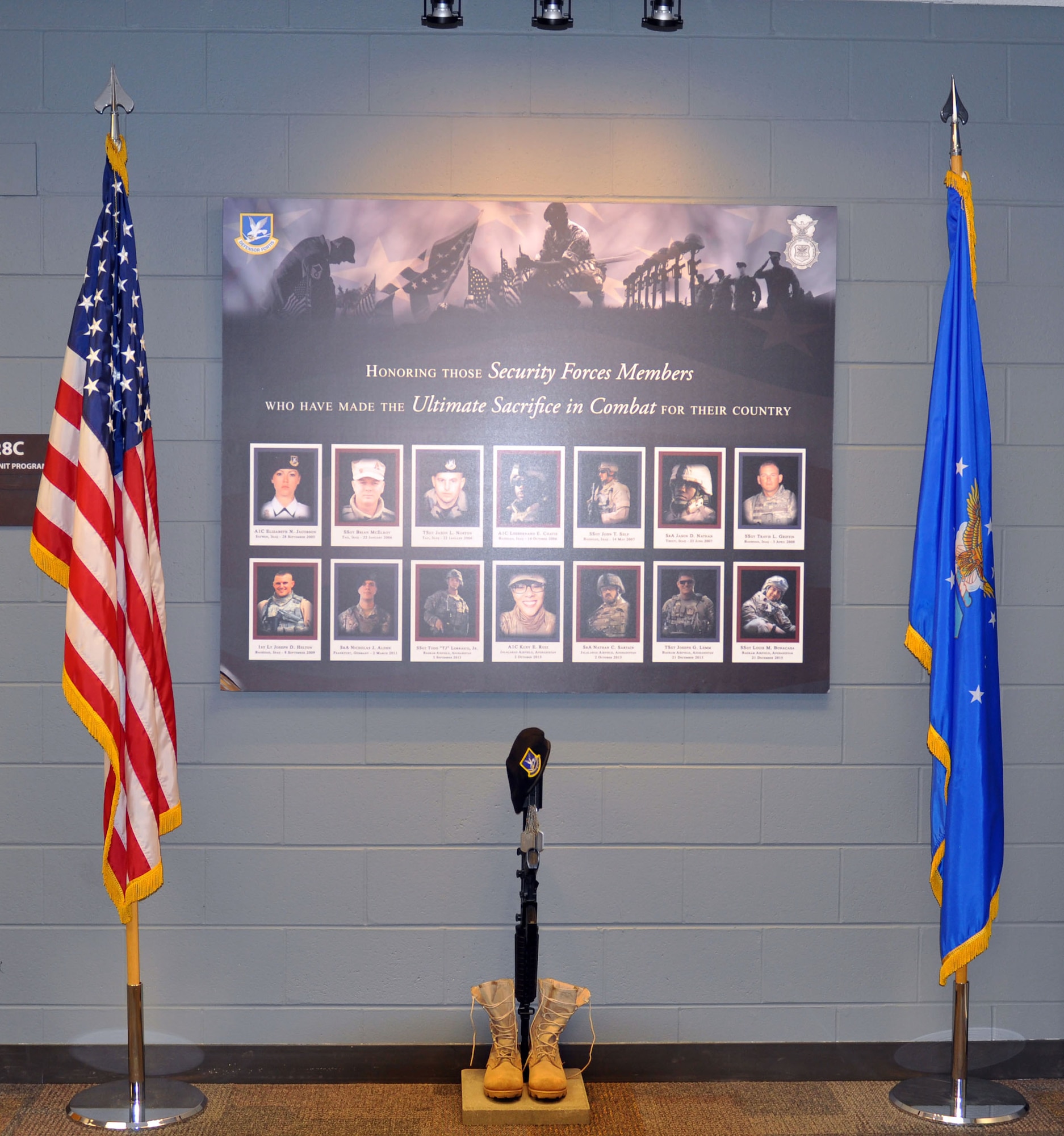 A special memorial honoring the fallen men and women serving in security forces across the Air Force is proudly displayed in the 445th Security Forces Squadron. It was built by a 445th SFS Airmen as his away to pay tribute and to recognize the sacrifices of the 14 fallen heroes. Staff Sgt. Dustin Ellison, 445th Security Forces Squadron SF craftsman, started working on the memorial March 2017. (U.S. Air Force photo/Tech. Sgt. Rachel Ingram)