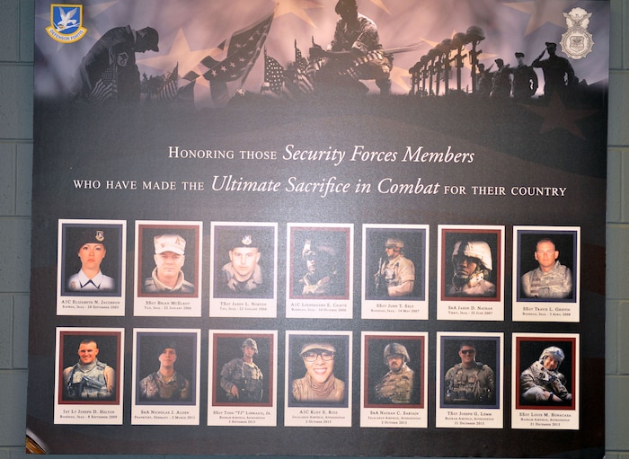 A special memorial honoring the fallen men and women serving in security forces across the Air Force is proudly displayed in the 445th Security Forces Squadron. It was built by a 445th SFS Airmen as his away to pay tribute and to recognize the sacrifices of the 14 fallen heroes. Staff Sgt. Dustin Ellison, 445th Security Forces Squadron SF craftsman, started working on the memorial March 2017. (U.S. Air Force photo/Tech. Sgt. Rachel Ingram)