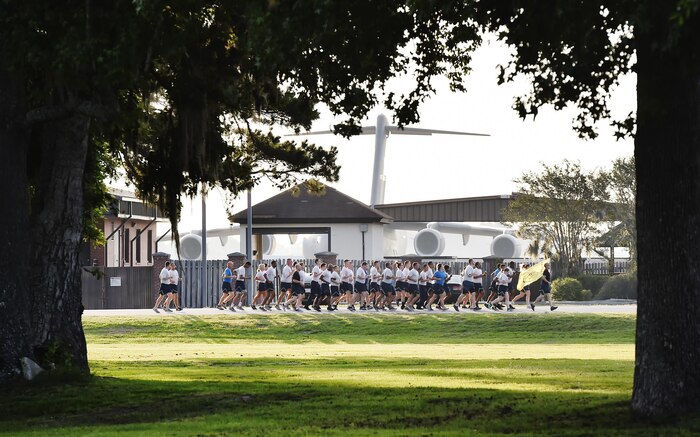 Airmen of the 437th Aerial Port Squadron, Air Force Reserve members and Air National Guardsmen, run in formation during the 4th Annual Port Dawg Memorial Run at Joint Base Charleston, S.C., May 12, 2017. The purpose of the run was to honor and remember fallen Port Dawgs, Airmen who lost their lives in the air transportation career field.
