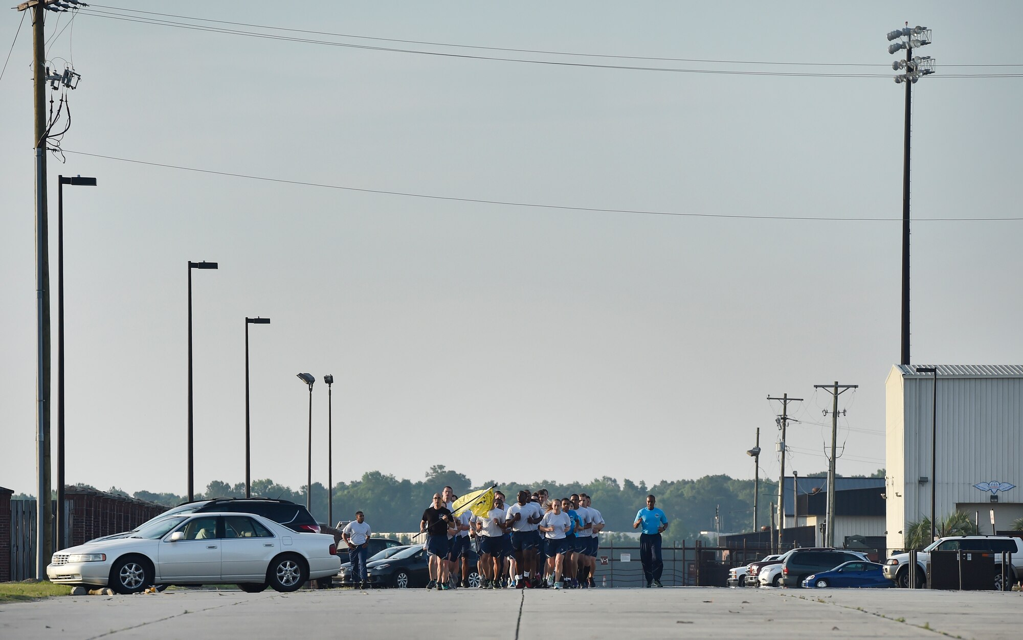 Airmen of the 437th Aerial Port Squadron, Air Force Reserve members and Air National Guardsmen, run in formation during the 4th Annual Port Dawg Memorial Run at Joint Base Charleston, S.C., May 12, 2017. The purpose of the run was to honor and remember fallen Port Dawgs, Airmen who lost their lives in the air transportation career field. 