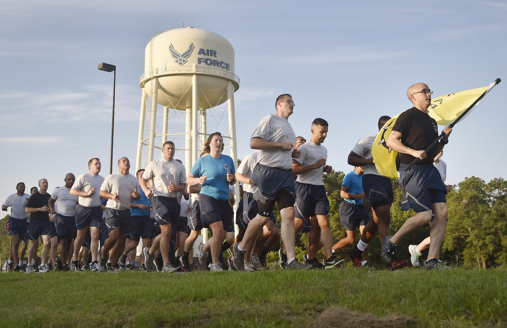 Airmen of the 437th Aerial Port Squadron, Air Force Reserve members and Air National Guardsmen, run in formation during the 4th Annual Port Dawg Memorial Run at Joint Base Charleston, S.C., May 12, 2017. The purpose of the run was to honor and remember fallen Port Dawgs, Airmen who lost their lives in the air transportation career field.