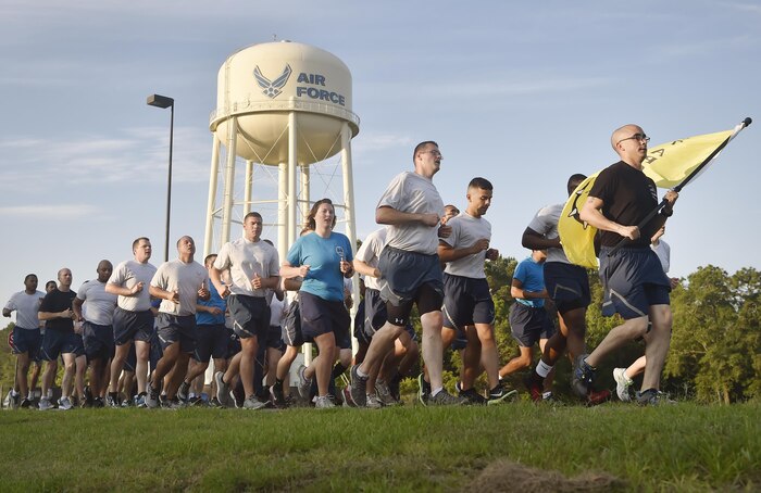 Airmen of the 437th Aerial Port Squadron, Air Force Reserve members and Air National Guardsmen, run in formation during the 4th Annual Port Dawg Memorial Run at Joint Base Charleston, S.C., May 12, 2017. The purpose of the run was to honor and remember fallen Port Dawgs, Airmen who lost their lives in the air transportation career field.