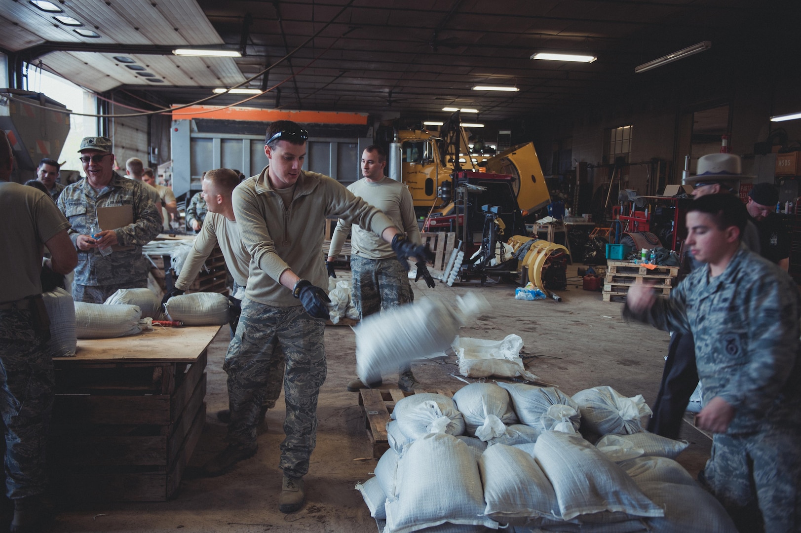 Airmen assigned to the 107th Attack Wing of the New York Air National Guard fill sandbags at the Kendall, N. Y. town garage on May 11, 2017, as part of the New York National Guard response to high water levels in Lake Ontario which resulted in local flooding. Between May 3 and May 13, 323 New York National Guard Soldiers and Airmen filled 239, 239,703 sandbags at six locations in counties along the lake. 