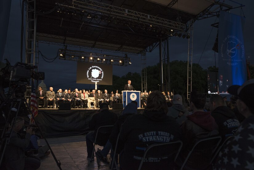 Police officers and family members attend the 29th Annual Candlelight Vigil honoring fallen police officers from around the country on the National Mall in Washington, D.C., May 13, 2017. Approximately 300 police officers' names were read, engraved into the National Police Memorial. Among those names was Staff Sgt. James D. McNaughton, a U.S. Army Reserve military police who was the first New York City police officer killed in action while deployed to Iraq, Aug. 2, 2005.