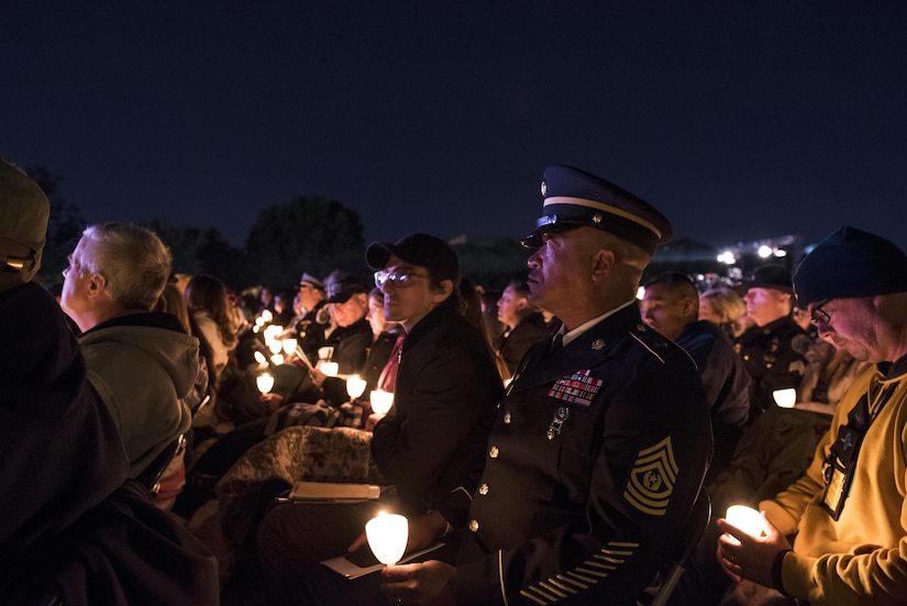 Command Sgt. Maj. Craig Owens, the senior enlisted leader for the 200th Military Police Command, attends the 29th Annual Candlelight Vigil honoring fallen police officers from around the country Saturday, on the National Mall in Washington, D.C., May 13, 2017. Approximately 300 police officers' names were read, engraved into the National Police Memorial. Among those names was Staff Sgt. James D. McNaughton, a U.S. Army Reserve military police who was the first New York City police officer killed in action while deployed to Iraq, Aug. 2, 2005.