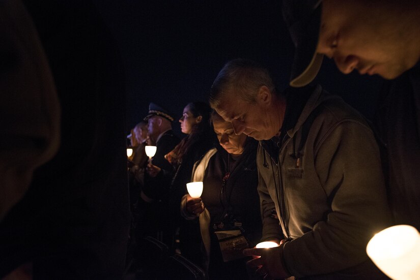 William and Michele McNaughton, from Centereach, New York, attend the 29th Annual Candlelight Vigil to represent their son, Staff Sgt. James D. McNaughton, being honored among other fallen police officers from around the country on the National Mall in Washington, D.C., May 13, 2017. McNaughton was a U.S. Army Reserve military police who was the first New York City police officer killed in action while deployed to Iraq, Aug. 2, 2005. Approximately 300 police officers' names were read, engraved into the National Police Memorial. (U.S. Army Reserve photo by Sgt. Audrey Hayes)