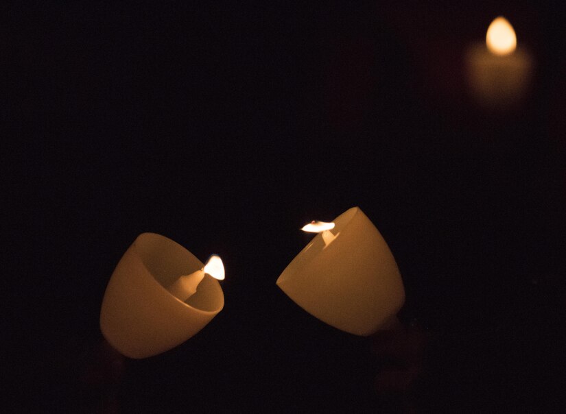 The flames of candles light up the dark during the 29th Annual Candlelight Vigil honoring fallen police officers from around the country on the National Mall in Washington, D.C., May 13, 2017. Approximately 300 police officers' names were read, engraved into the National Police Memorial. Among those names was Staff Sgt. James D. McNaughton, a U.S. Army Reserve military police who was the first New York City police officer killed in action while deployed to Iraq, Aug. 2, 2005. (U.S. Army Reserve photo by Sgt. Audrey Hayes)