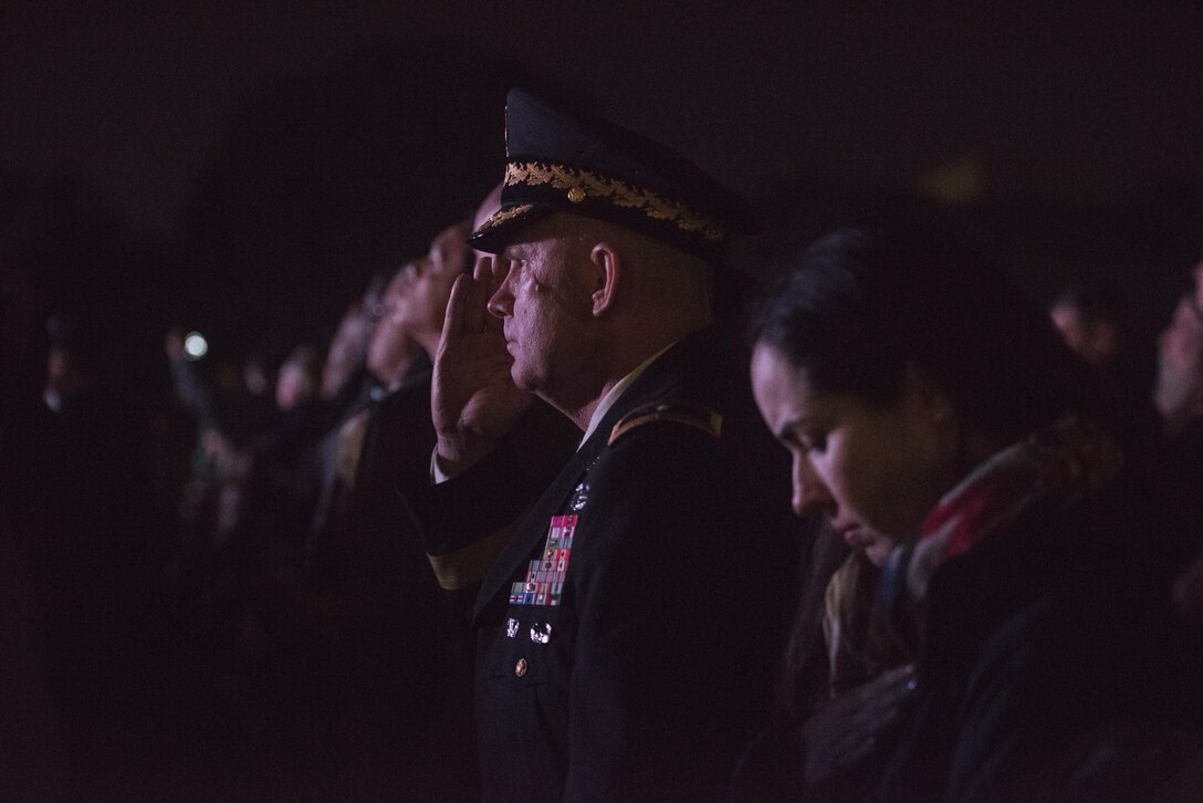 Brig. Gen. John Hussey, commander of the Great Lakes Training Division, Fort Sheridan, Illinois, renders a salute during the 29th Annual Candlelight Vigil honoring fallen police officers from around the country on the National Mall in Washington, D.C., May 13, 2017. Approximately 300 police officers' names were read, engraved into the National Police Memorial. Among those names was Staff Sgt. James D. McNaughton, a U.S. Army Reserve military police who was the first New York City police officer killed in action while deployed to Iraq, Aug. 2, 2005. (U.S. Army Reserve photo by Sgt. Audrey Hayes)