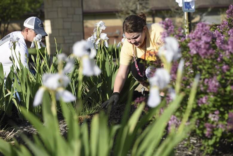 Operations Veterans Rising volunteers beautify the exterior of the Warrensburg Veterans Home, Mo., April 15, 2017. The Operation Veterans Rising is a non-profit organization created to help veterans and their families rise up from their daily struggles through a variety of financial aid programs.  (U.S. Air Force photo/ Senior Airman Danielle Quilla) 