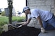 U.S. Air Force Master Sgt. Justin McCowan, the Operations Veterans Rising (OVR) president and a production control supervisor assigned to the 442d Maintenance Group, places new mulch to beautify the exterior of the Warrensburg Veterans Home, Mo., April 15, 2017. The Operation Veterans Rising is a non-profit organization created to help veterans and their families rise up from their daily struggles through a variety of financial aid programs. (U.S. Air Force photo/ Senior Airman Danielle Quilla) 