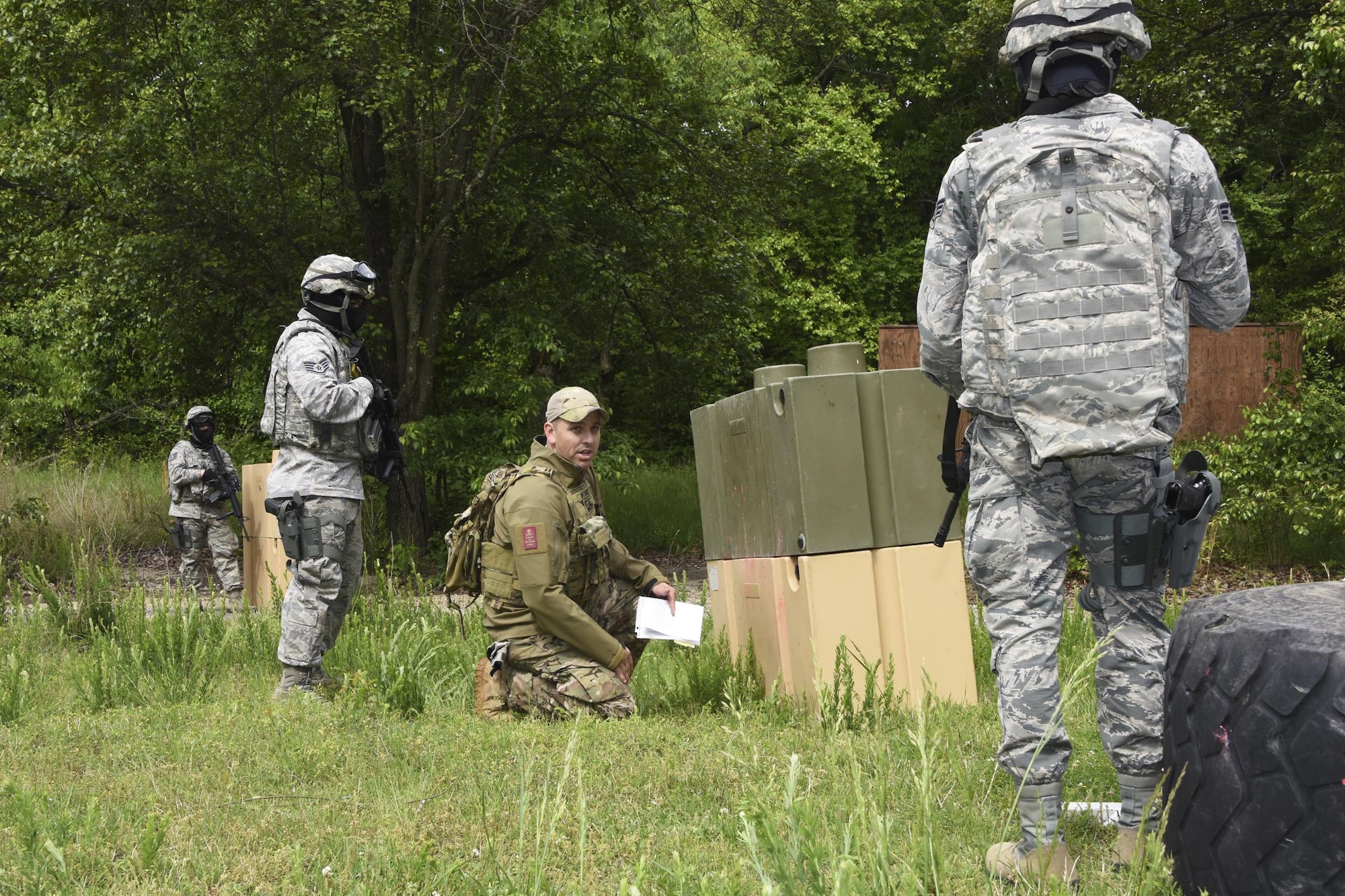 U.S. Air Force Tech. Sgt. Michael Perez, an instructor with the 459th Security Forces Squadron, teaches target engagement techniques to 459th SFS members during “Shoot, Move, Communicate” Training on May 7, 2017. All SFS members must qualify with the M4 Rifle and M9 pistol annually in conjunction with quarterly SMC Training in order to maintain currency and keep their skills sharp.