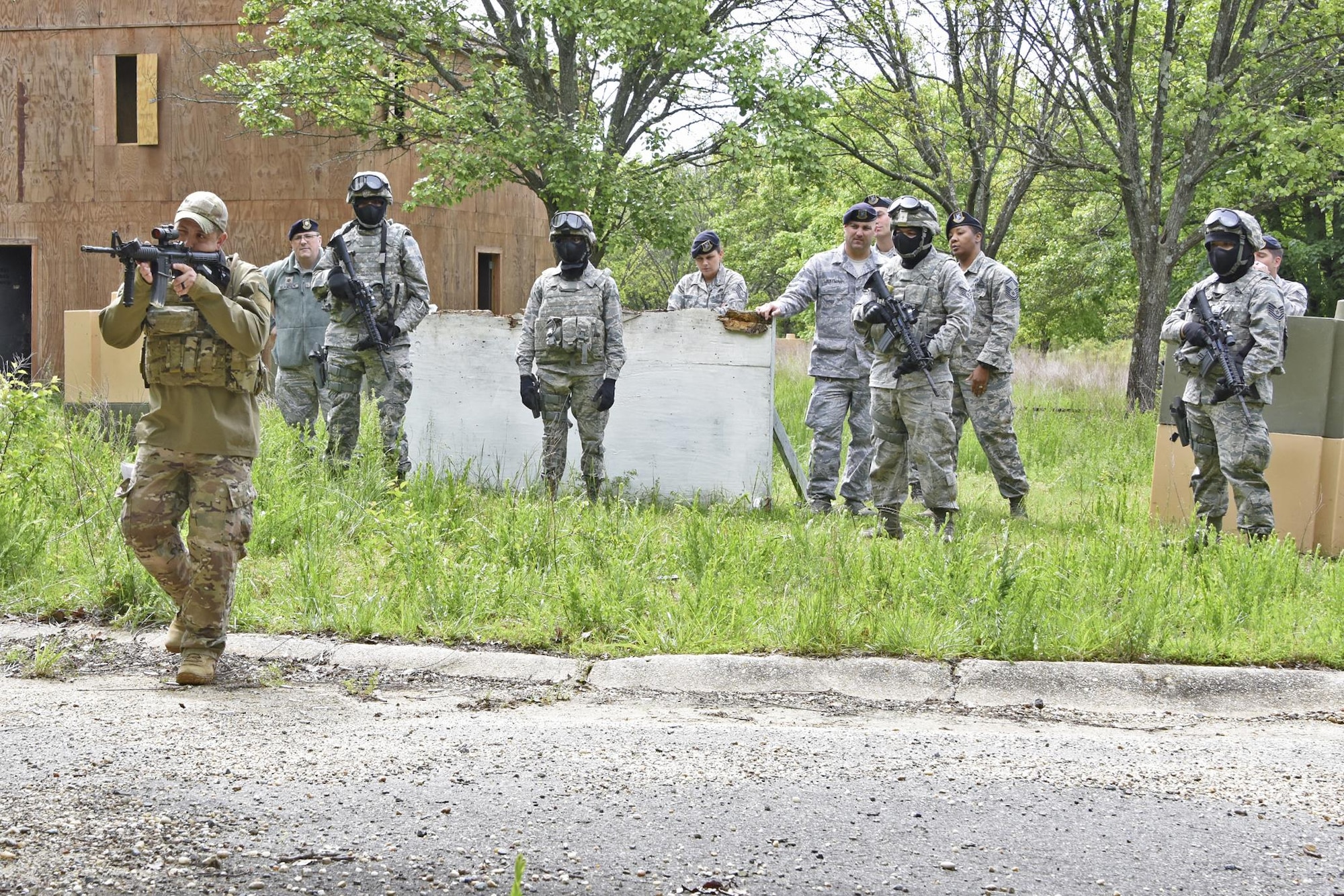 U.S. Air Force Tech. Sgt. Michael Perez, a 459th Security Forces Squadron instructor, demonstrates to 459th Security SFS members how to engage a target during “Shoot, Move, Communicate” Training on May 7, 2017. All SFS members must qualify with the M4 Rifle and M9 pistol annually in conjunction with quarterly SMC Training in order to maintain currency and keep their skills sharp.