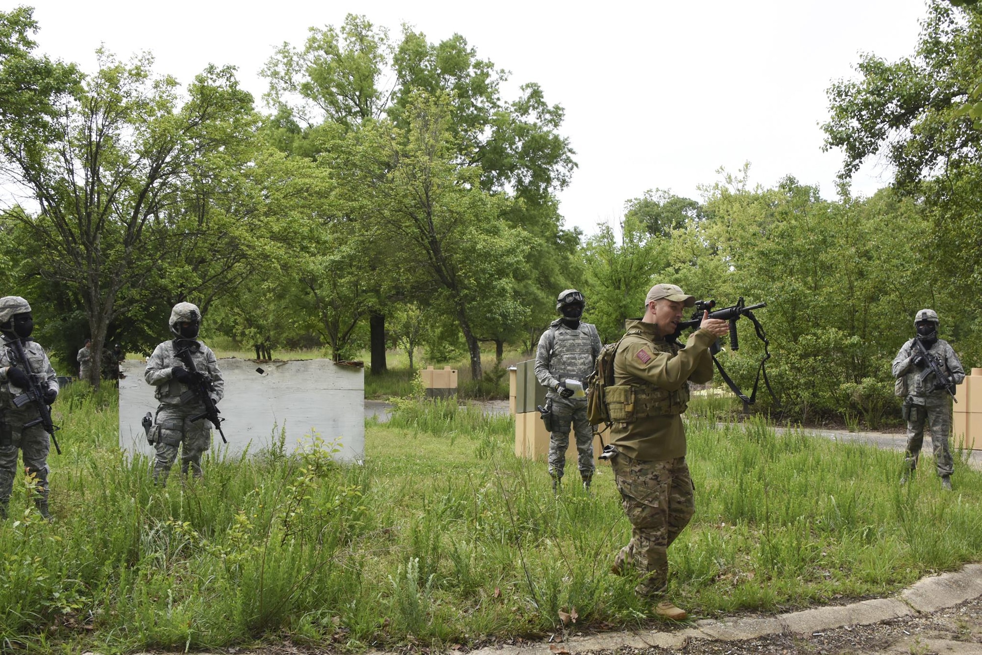 U.S. Air Force Tech. Sgt. Michael Perez, a  459th Security Forces Squadron instructor, demonstrates to 459th SFS members how to engage a target during “Shoot, Move, Communicate” Training on May 7, 2017. All SFS members must qualify with the M4 Rifle and M9 pistol annually in conjunction with quarterly SMC Training in order to maintain currency and keep their skills sharp.