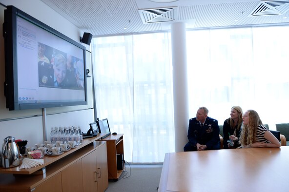 Col. Joseph McFall, 52nd Fighter Wing commander, promotes his sister, Theresa Goodman, to the rank of colonel via video teleconferencing technology, May 15, 2017 at Spangdahlem Air Base, Germany. Goodman is a medical inspector at the Air Force Inspection Agency headquarters at Kirtland Air Force Base, New Mexico, 5296 miles away from Spangdahlem. (U.S. Air Force photo by Tech. Sgt. Staci Miller)