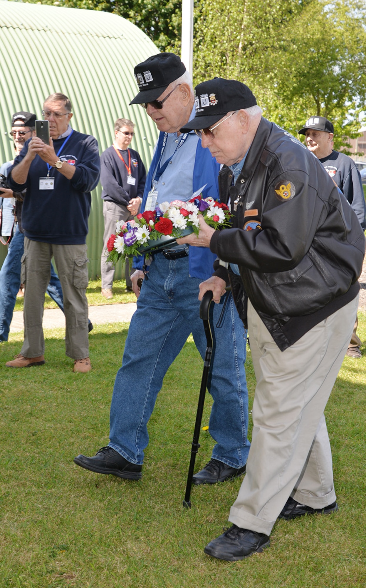 Veterans of the 100th Bombardment Group (Heavy), Master Sgt. (retired) Dewey Christopher, center, and Staff Sgt (retired) Joe Urice, right, prepare to lay a wreath May 10, 2017, at Parham Airfield Museum, Framlingham, Suffolk. The 100th Bomb Group veterans visited England with family members and others from the 100th BG Foundation as part of the 100th anniversary of the 100th BG and 25th anniversary of the 100th Air Refueling Wing and toured former East Anglian World War II bases including Thorpe Abbots, Horham and Rattlesden. (U.S. Air Force photo by Karen Abeyasekere)