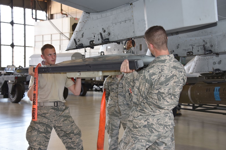 Airmen Aaron Beshears and Colton Curry, 363rd Training Squadron A-10 students, learn how to remove and install a dual rail adapter on station one of the A-10 aircraft at Sheppard Air Force Base, Texas, March 23, 2017. This training course lasts approximately 68 days. (U.S. Air Force photo by Liz H. Colunga/Released)  