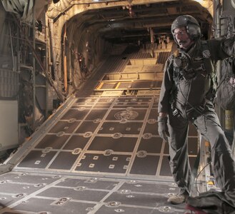 U.S. Air Force Command Sgt. Maj. Archie Branton, loadmaster with 911th Air Wing and 758th Airlift Squadron, waits to open the back ramp for soldiers of the West Virginia Army National Guard to perform a static-line parachute jump out of a C-130 aircraft on Saturday, March 13, 2017 during the Wings Over Pittsburgh Open House.  The 911th Airlift Wing hosted the two-day event, which has not been held for the past six years, was held over Mother's Day weekend. (U.S. Army photo by Staff Sgt. Shaiyla Hakeem/Released).