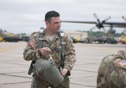 U.S. Army Master Sgt. Michael Contic, with West Virginia Army National Guard's 2nd Battalion, 19th Special Forces Group, prepares to gear up to parachute from a C-130 aircraft Saturday, March 13, 2017, during the Wings over Pittsburgh Open House. The event, hosted by the 911th Air Wing and 758th Aviation Squadron, was collaboration with the Air Force Reserve, Army National Guard, Army Reserve and the Navy Reserve. (U.S. Army photo by Staff Sgt. Shaiyla Hakeem/Released).