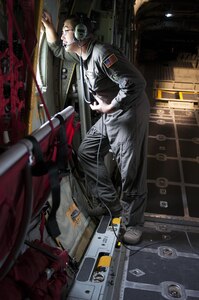 U.S. Air Force Master Sgt. Chris Karwowski gazes out the window of a C-130 aircraft on Saturday, March 13, 2017, during the Wings Over Pittsburgh on the 911th Air Wing in Coraopolis, Pennsylvania. The theme this year was "Forging the Future" with the headlining show from the U.S. Air Force Thunderbirds. (U.S. Army photo by Staff Sgt. Shaiyla Hakeem/Released).