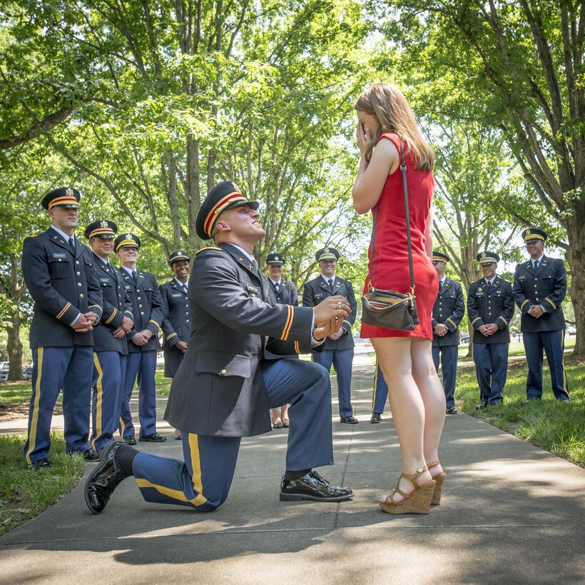 Brand new U.S. Army 2nd Lt. Allen Robertson proposes to his girlfriend, Chelsea Campbell, immediately after his Clemson University Reserve Officers’ Training Corps commissioning ceremony, May 10, 2017. The two met while they were students at Clemson and will both graduate this week. Robertson, who hails from Mooresville, N.C., earned a degree in accounting at Clemson and his first duty station will be with at Fort Campbell, Ky. with the 101st Airborne Division. Campbell, of Fort Mill, S.C., earned her degree in psychology. (U.S. Army Reserve photo by Staff Sgt. Ken Scar)